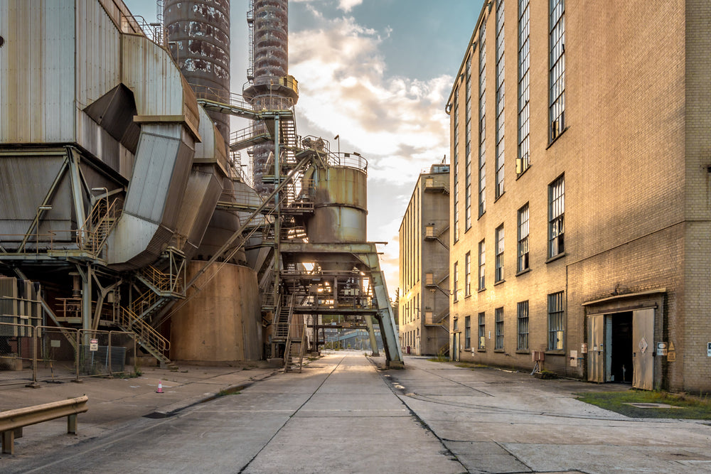Precipitator at Morwell Power Station, a concrete roadway runs between the precipitator housing and a three-storey cream.