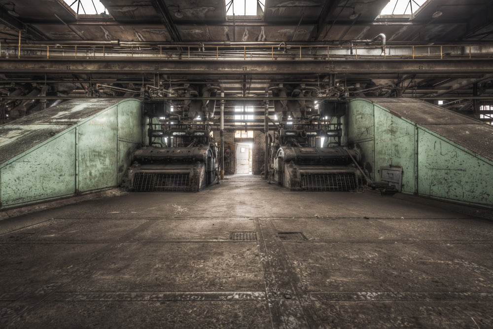 Press Covers at Morwell Power Station, two pale green steel covers angle upward from the concrete floor, flanking a narrow.
