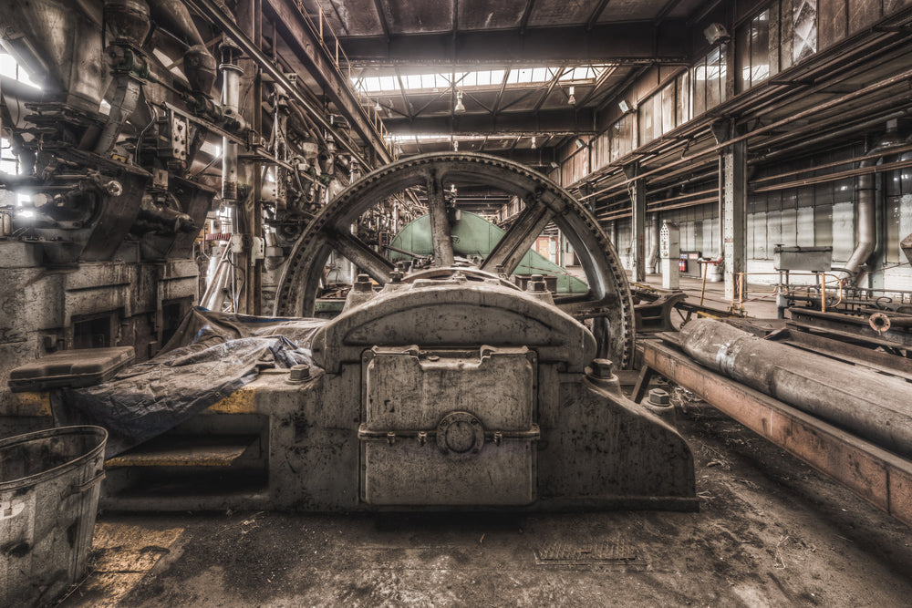 Press Floor at Morwell Power Station, a heavy flywheel sits at the centre of the frame, bolted to a large reciprocating.