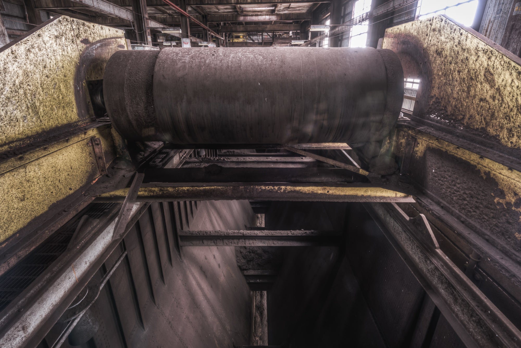 Raw Coal Bunker at Morwell Power Station, a massive steel drum roller sits at the top of the coal bunker, mounted.