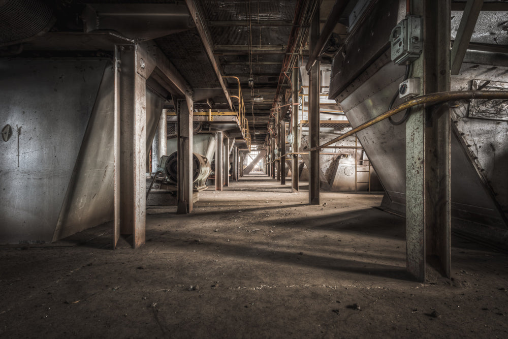 Screen Floor at Morwell Power Station, steel hoppers line both sides of a narrow corridor, their conical bases suspended.