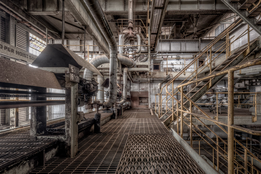 Soot Blower at Morwell Power Station, steel grating stretches down a narrow service walkway between boiler units.