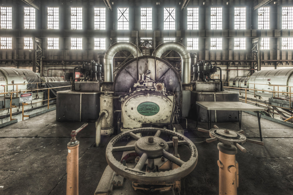 Turbine Front at Morwell Power Station, a heavy cast-iron valve wheel sits in the foreground, its spokes thick with dust.