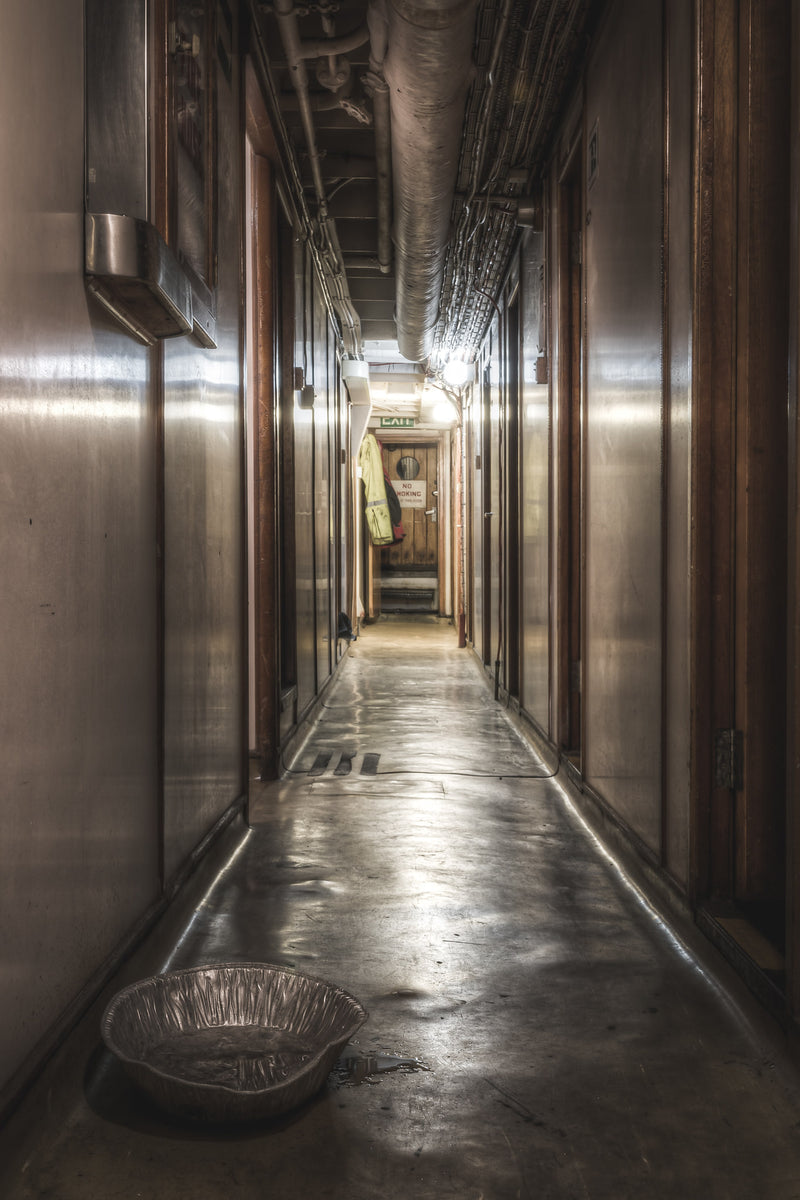 Don Starboard Side Corridor at MV Cape Don, a narrow corridor runs deep into the ship's starboard side.