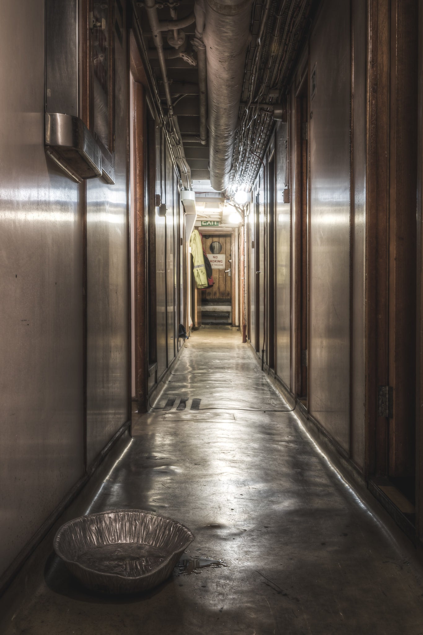 Don Starboard Side Corridor at MV Cape Don, a narrow corridor runs deep into the ship's starboard side.