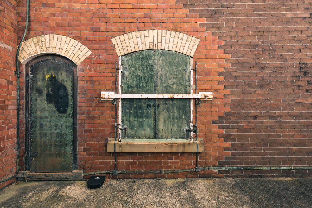 Magazine Hatch at Newington Armory, red brick facade, two arched openings side by side.