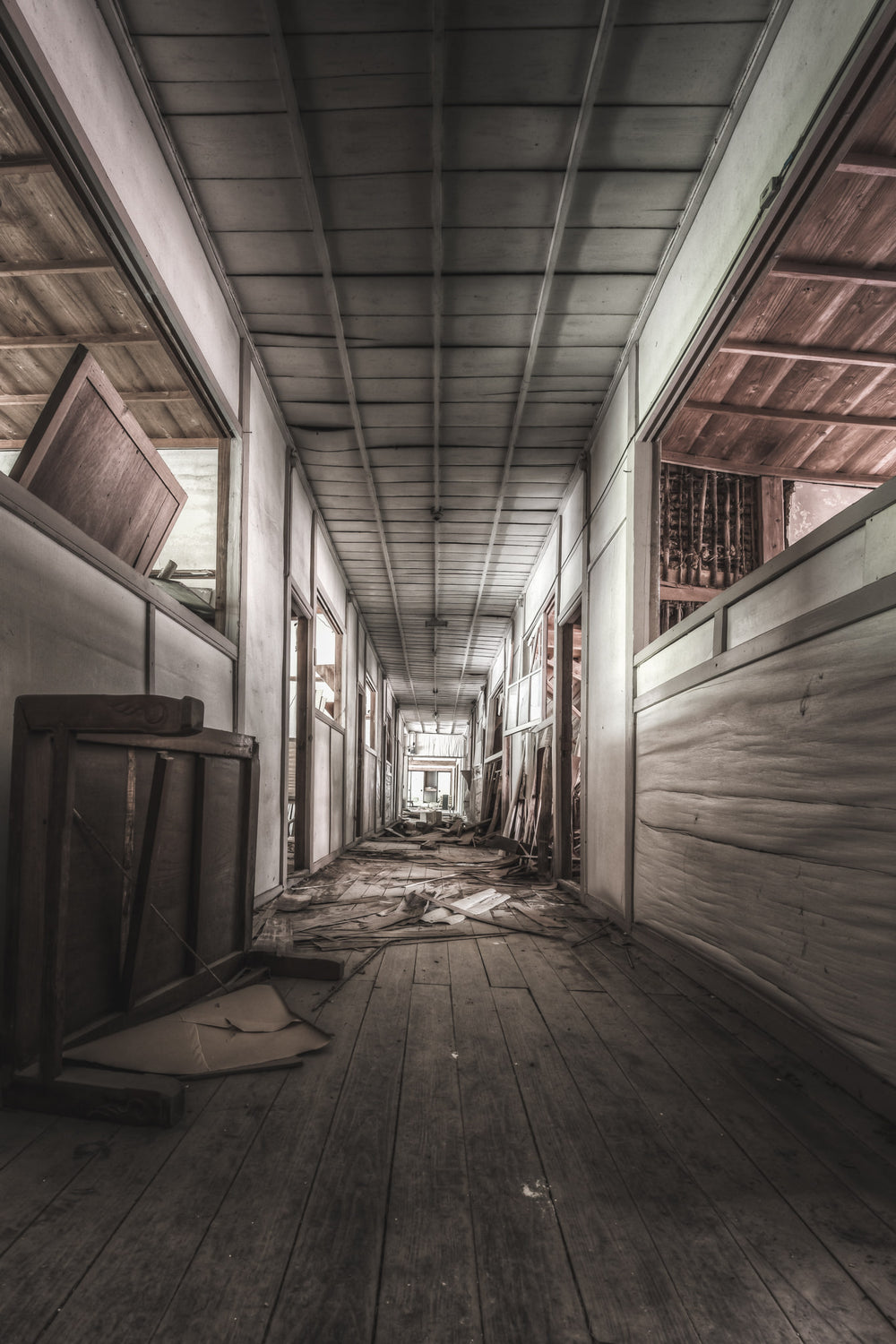 School Hall at Nichitsu Mining Village, a timber floored corridor running past the classrooms.