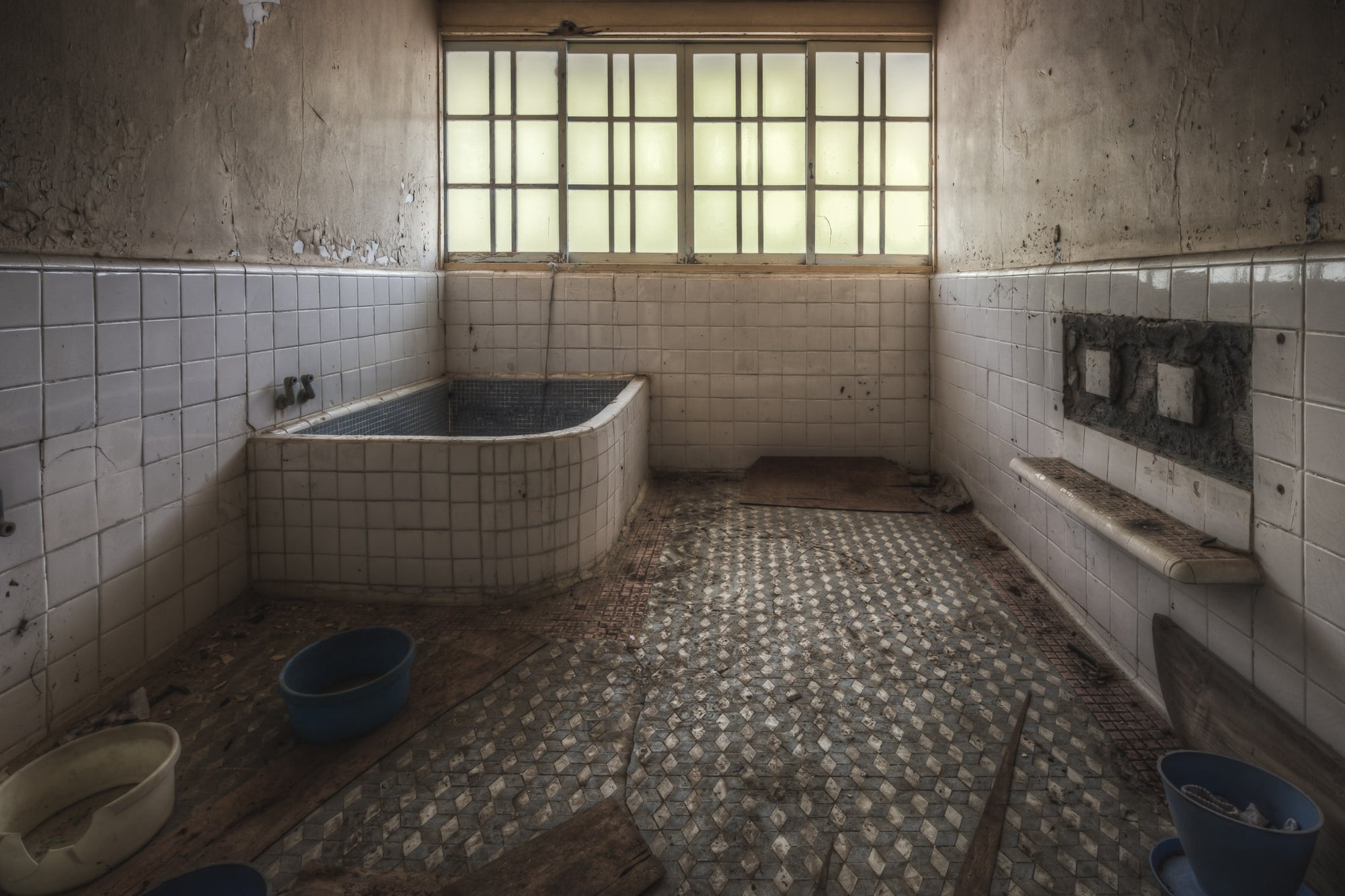 Yokusou at Nichitsu Mining Village, a small bathhouse room, tiled floor to ceiling in white square ceramic.