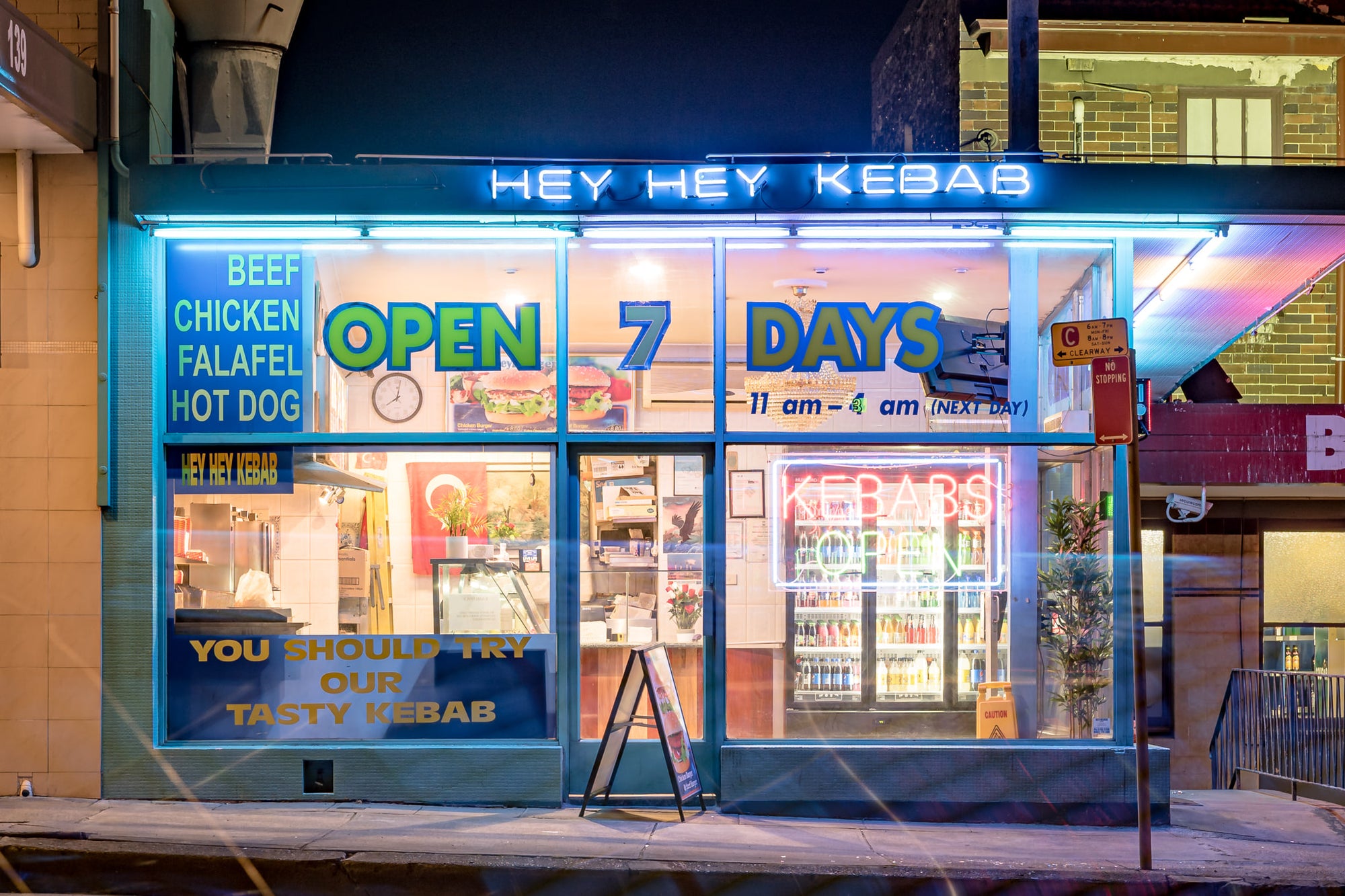Hey Hey Kebab at Parramatta Road, blue neon spells out HEY HEY KEBAB across the fascia.