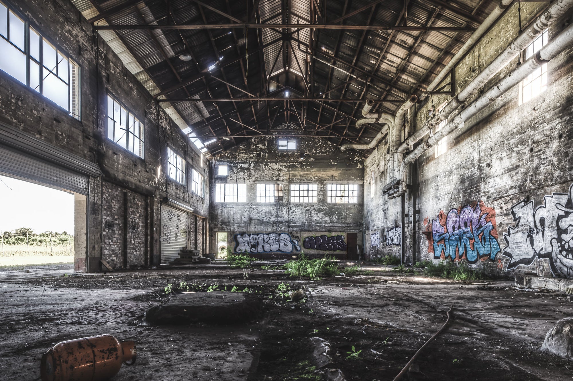 Boiler House at Peters Ice Cream Factory, the towering boiler house interior at Peters' Ice Cream Factory reveals immense, silent machinery.