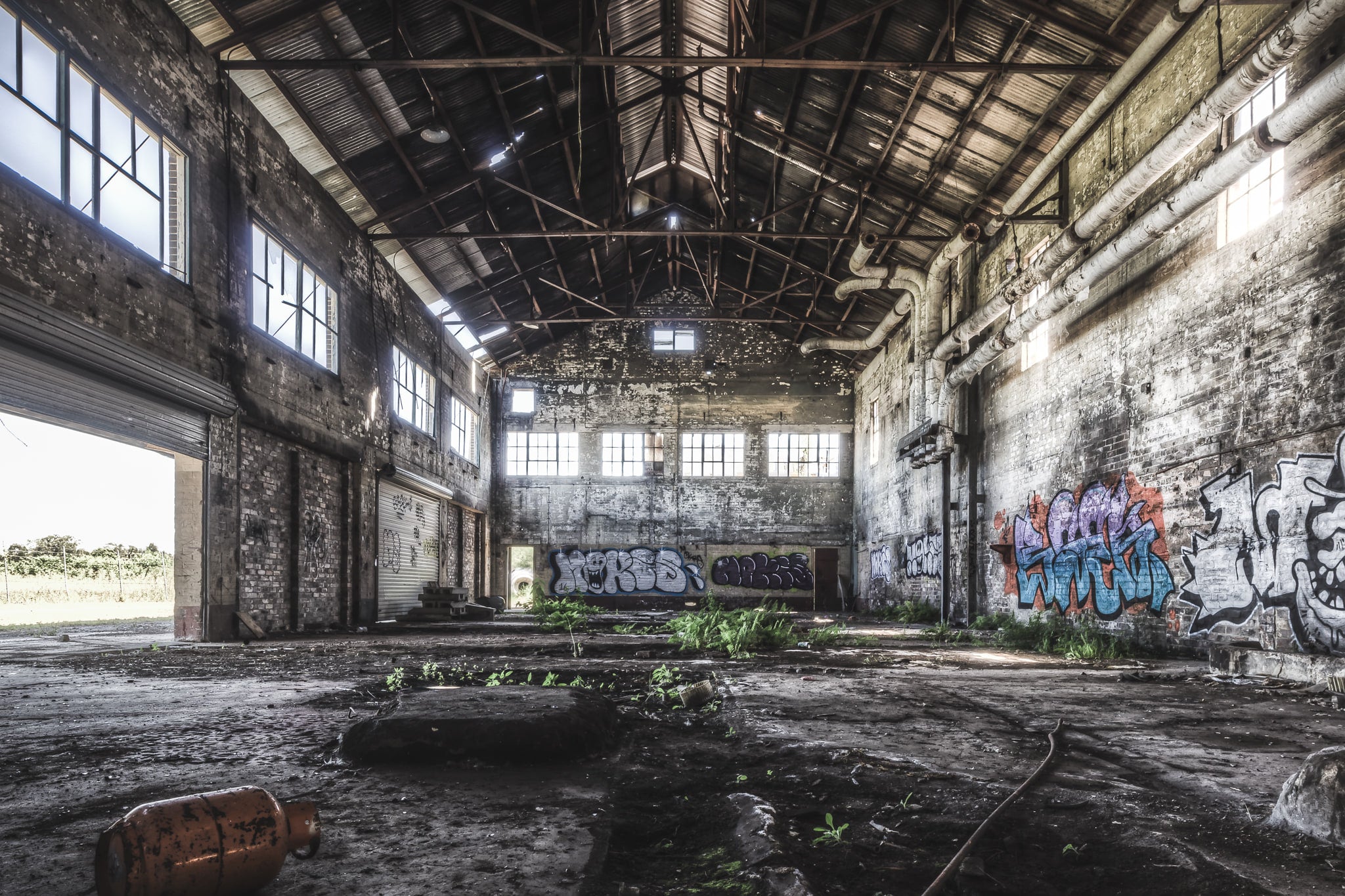 Boiler House at Peters Ice Cream Factory, the towering boiler house interior at Peters' Ice Cream Factory reveals immense, silent machinery.