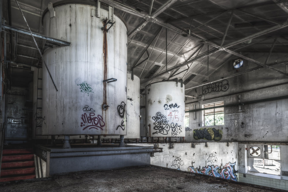 Concentrate Room at Peters Ice Cream Factory, disused machinery and intricate pipework remain, once vital to production.