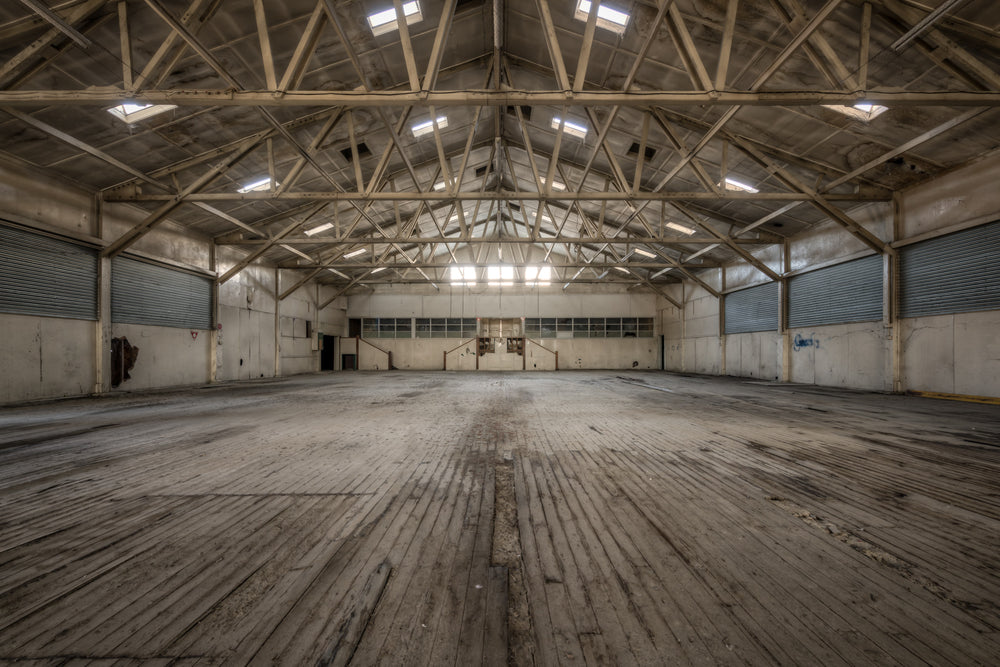 Annex at Portland Cement Works, steel roof trusses span the full width of the building, their web of angled braces.
