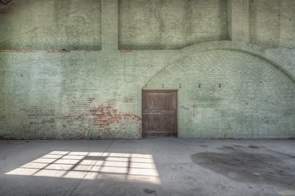 Boiler House Door at Portland Cement Works, a pale green wash covers the brickwork of the boiler house interior.