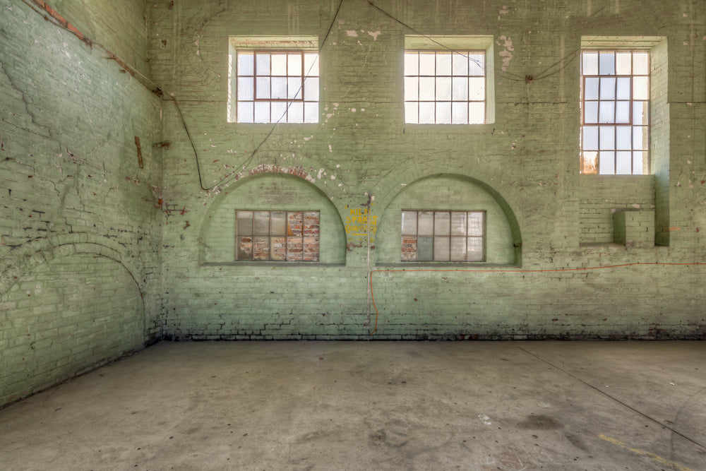 Boiler House Flues at Portland Cement Works, green-painted brick rises two storeys high.
