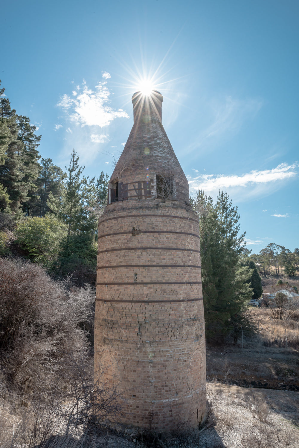 Bottle Kiln at Portland Cement Works, the cylindrical body is built from pale fired brick, banded at intervals by darker.