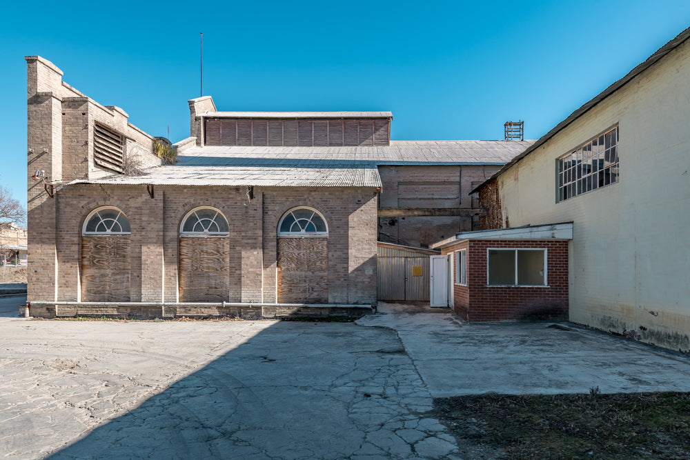 Power House Platform Side Exterior at Portland Cement Works, cream brick and pale sandstone form the rear elevation.