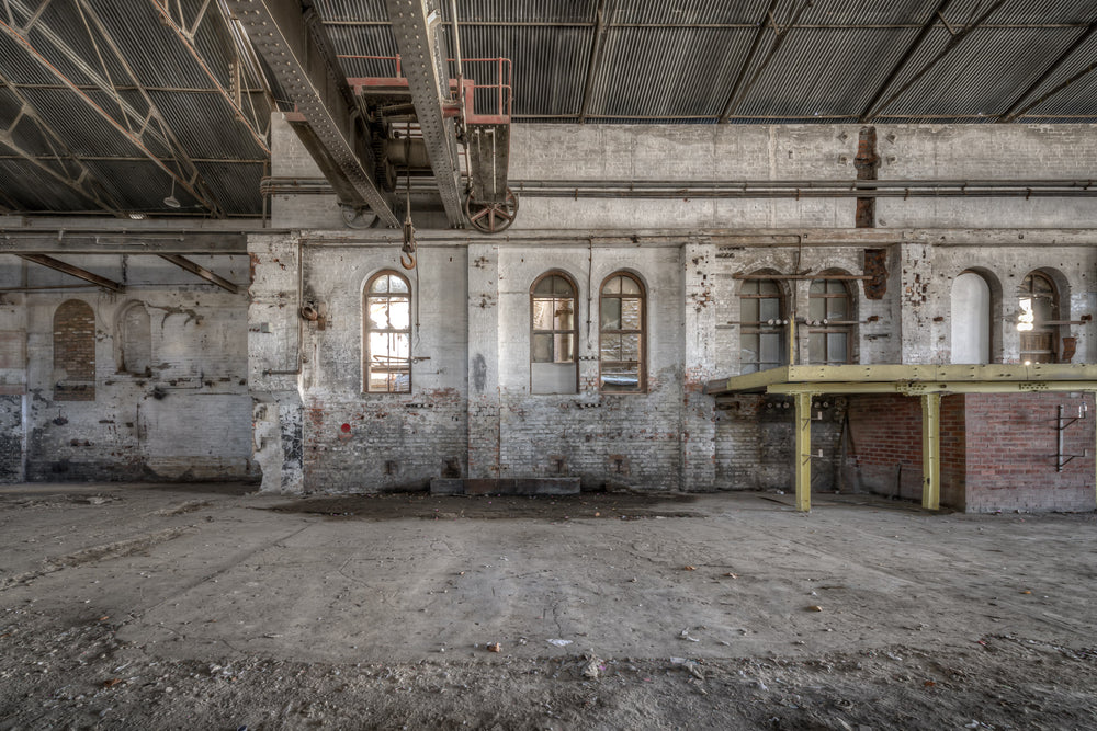 Power House Platform at Portland Cement Works, an overhead crane rail runs the length of the hall, its rusted hoist.