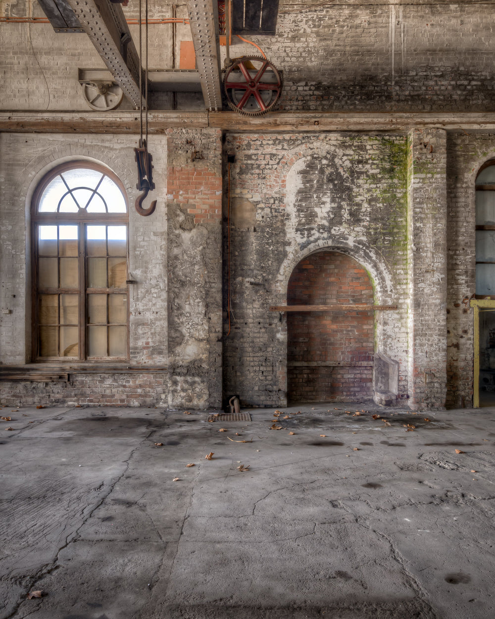 Power House West Interior at Portland Cement Works, arched windows line the western wall of the power house, their steel.