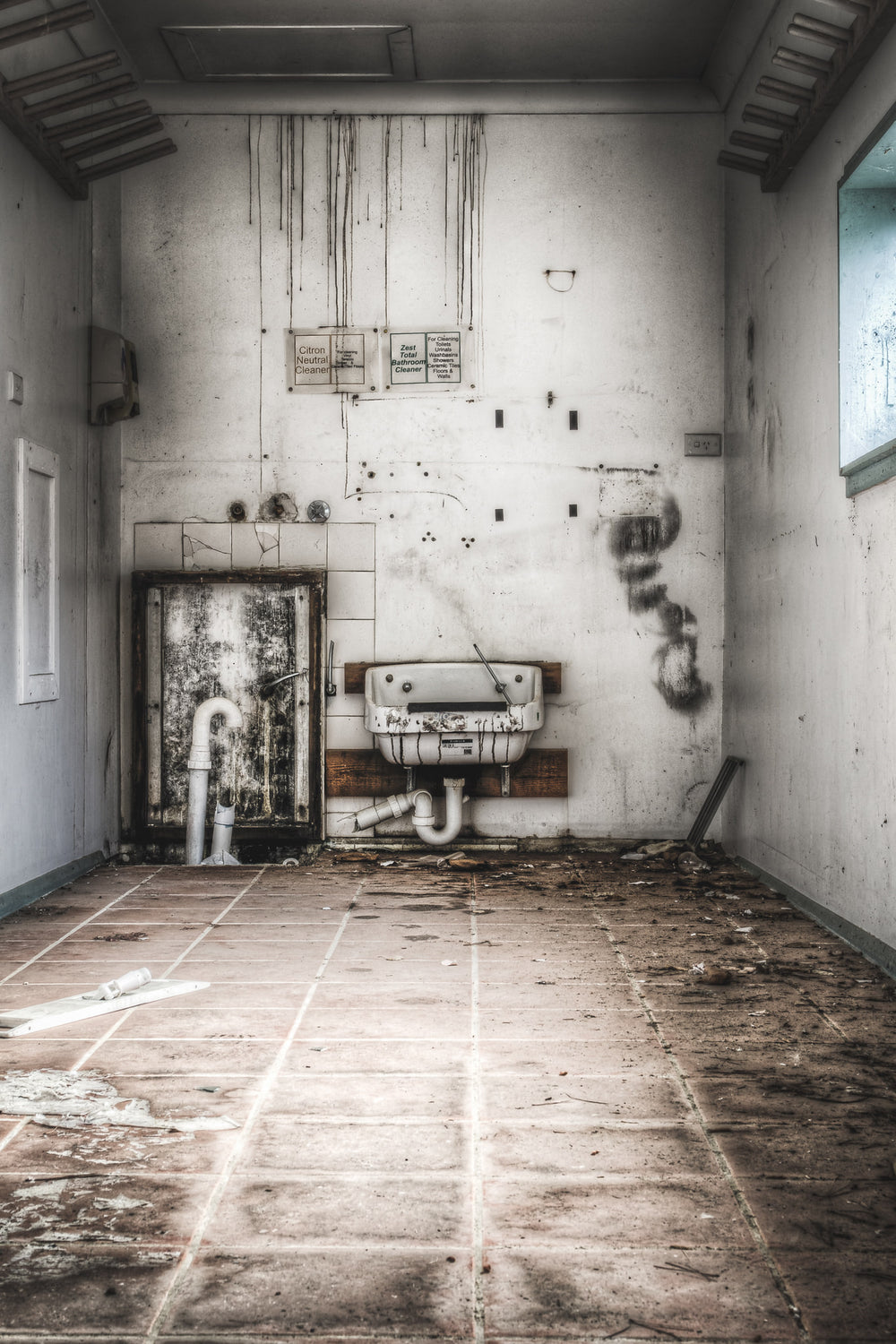 Cleaners Room at Queen Victoria Sanitorium, some hanging racks high on the walls, perhaps for storing brooms/mops, etc.