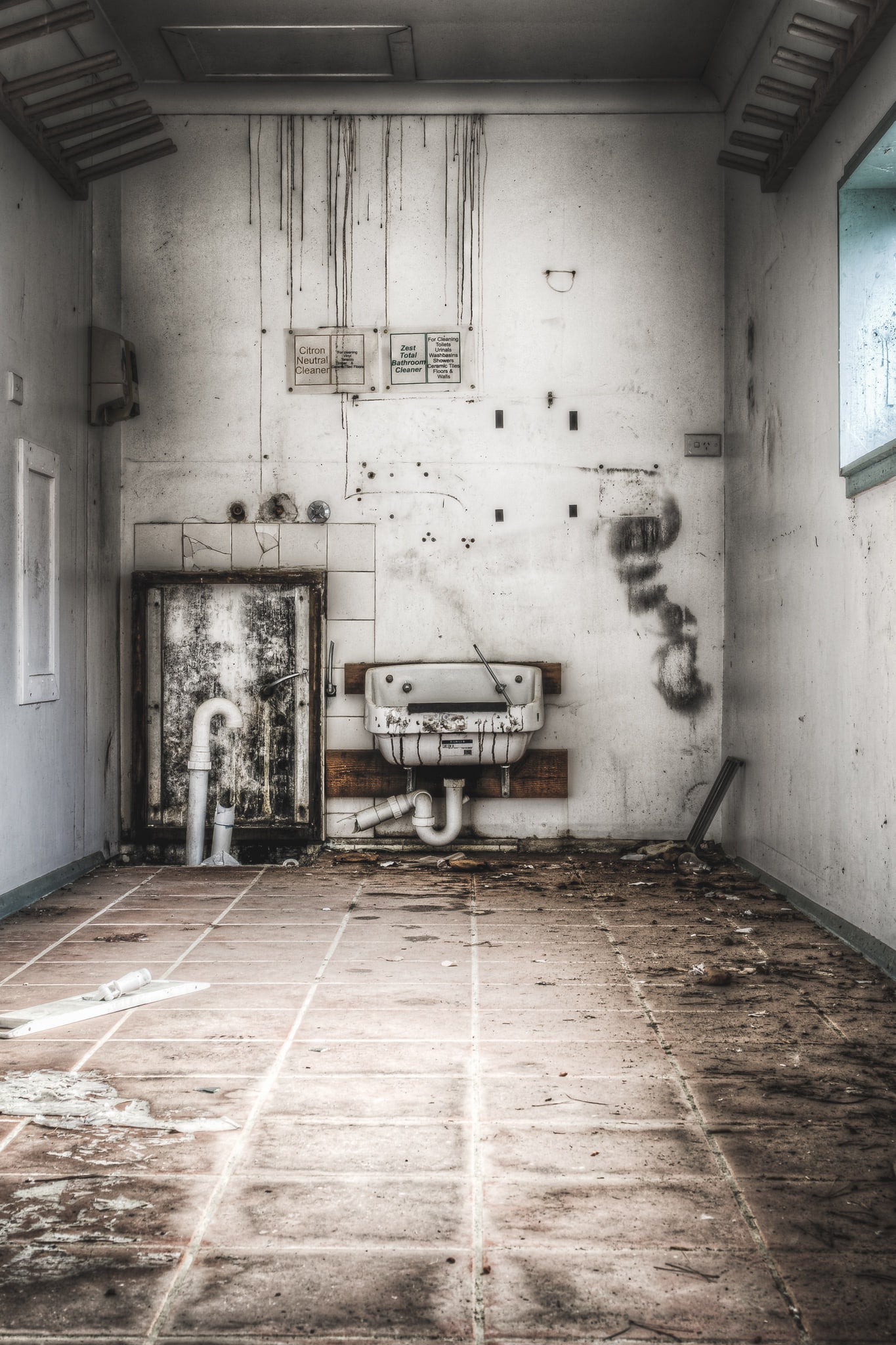 Cleaners Room at Queen Victoria Sanitorium, some hanging racks high on the walls, perhaps for storing brooms/mops, etc.