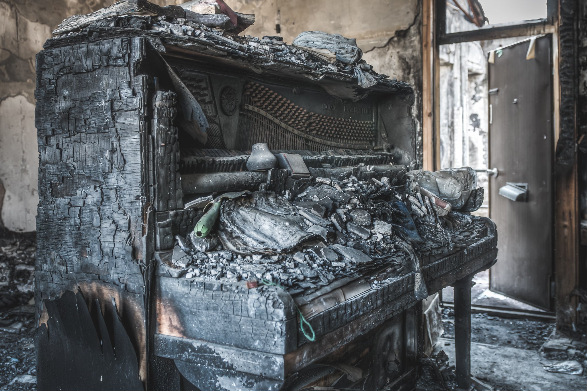 Charred Piano at Seika Dormitory, this piano was almost entirely burnt by the fire.