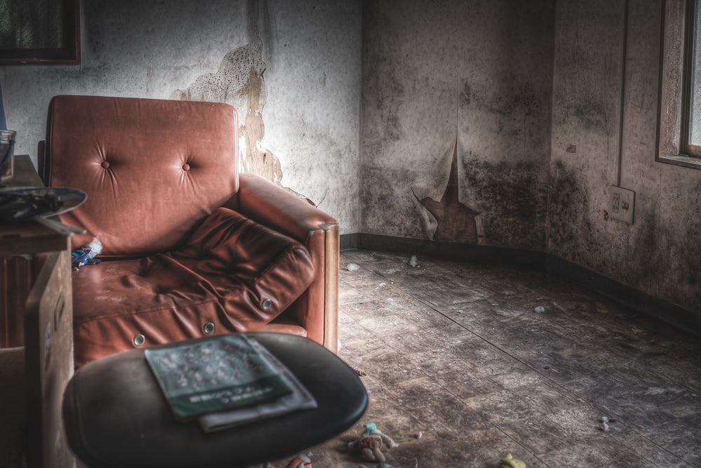 Sofa at Seika Dormitory, a dilapidated sofa sits in a deserted room at Seika Dormitory.