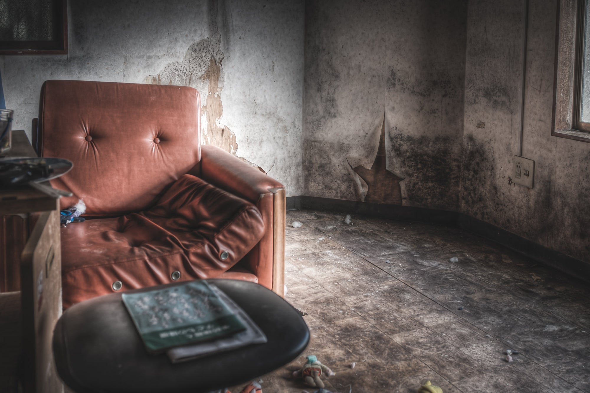 Sofa at Seika Dormitory, a dilapidated sofa sits in a deserted room at Seika Dormitory.