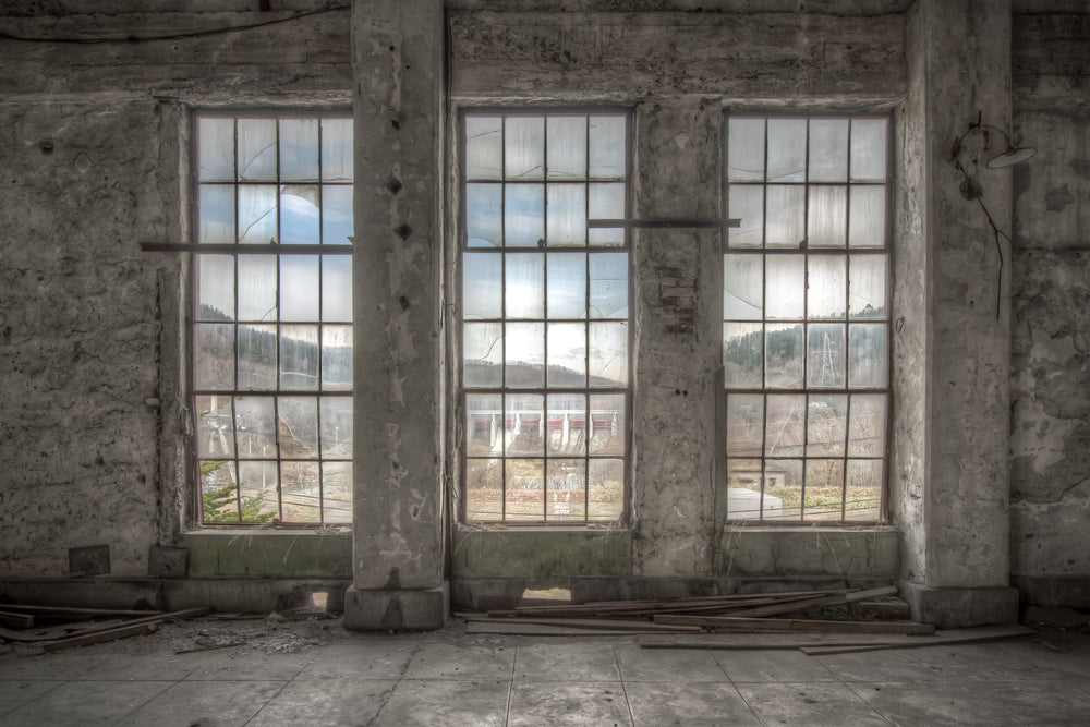 Three Windows at Shimizusawa Thermal Power Plant, three tall windows line the control room wall, their steel-mullioned frames set into heavy concrete pillars.