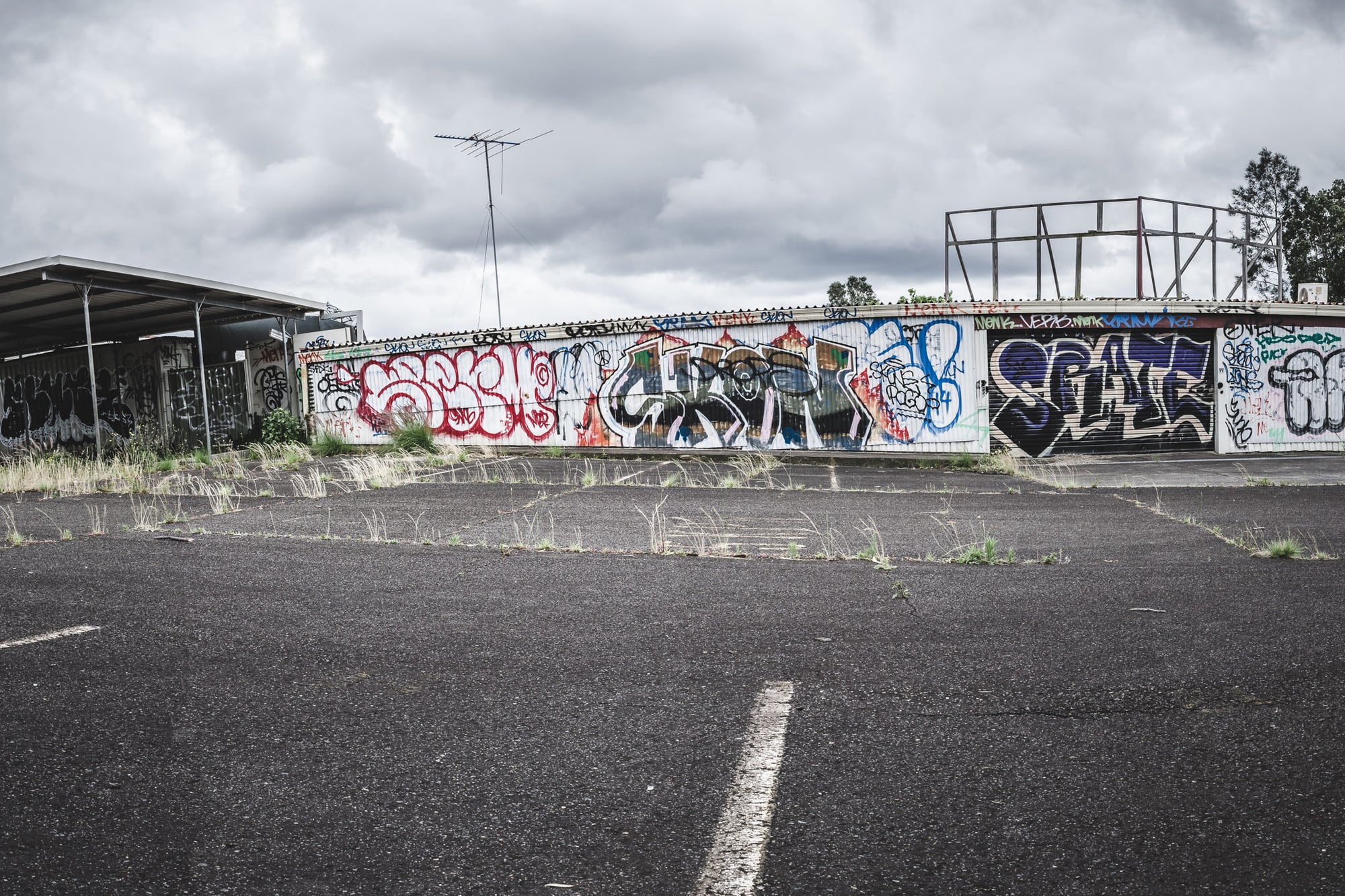 Car Park at Sundell Holden, a wide asphalt car park stretches out under heavy grey cloud.