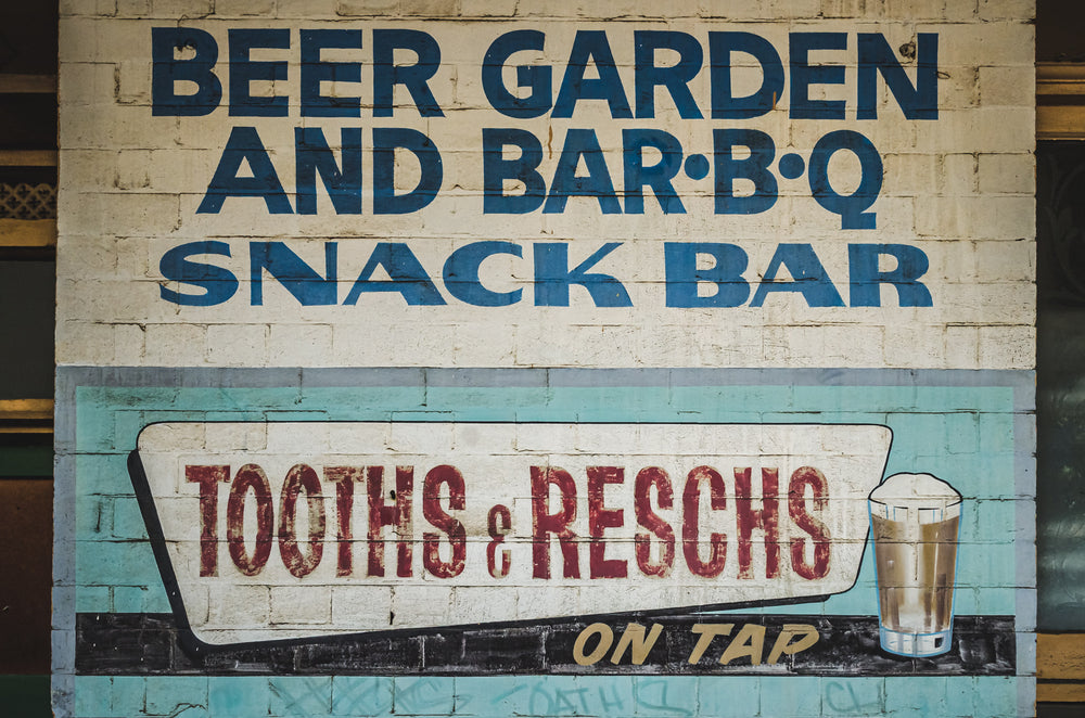 Painted Exterior Advertisement at Terminus Hotel, a detail from the outer wall of the Terminus Hotel, where painted signage.