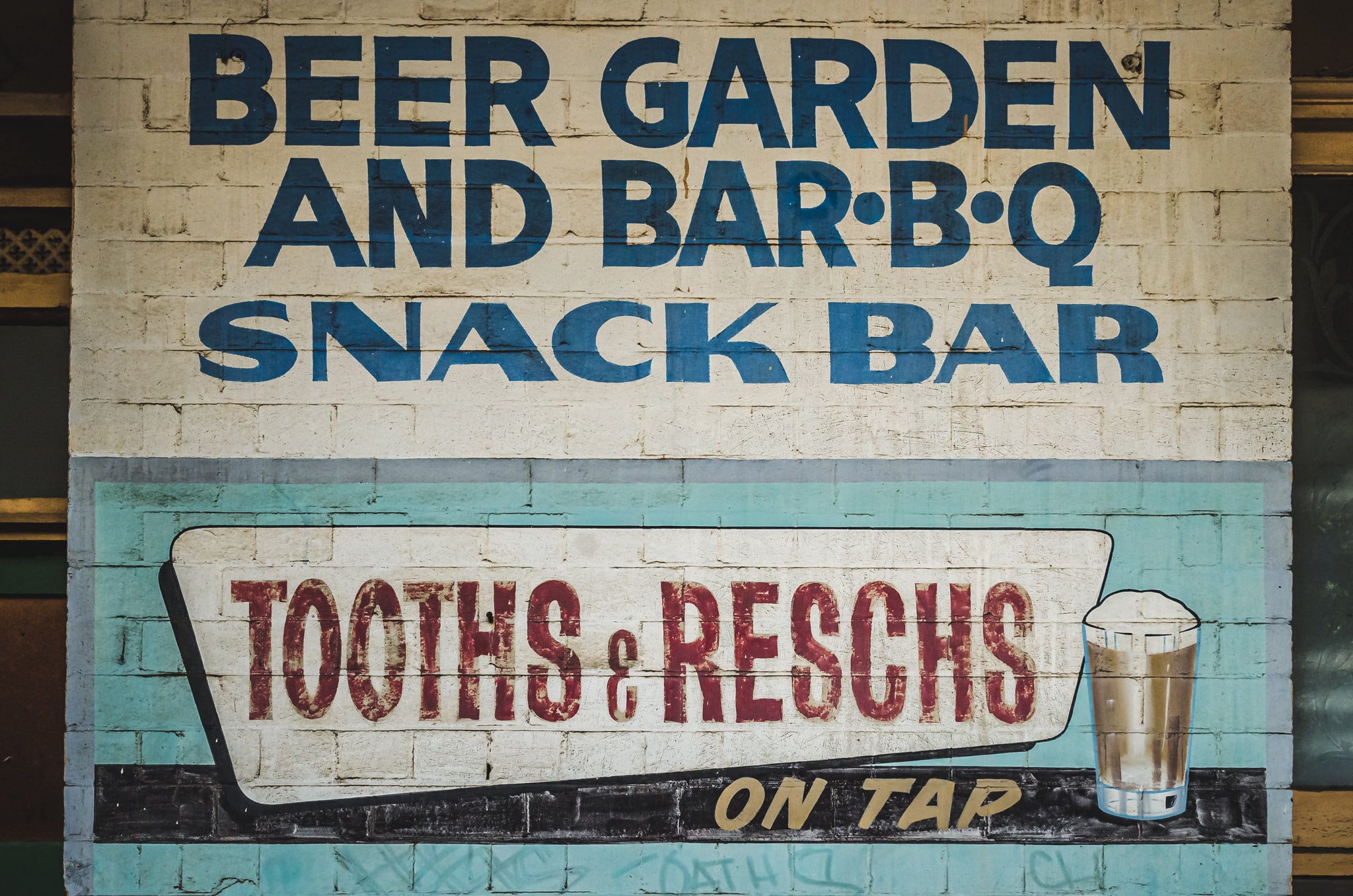 Painted Exterior Advertisement at Terminus Hotel, a detail from the outer wall of the Terminus Hotel, where painted signage.