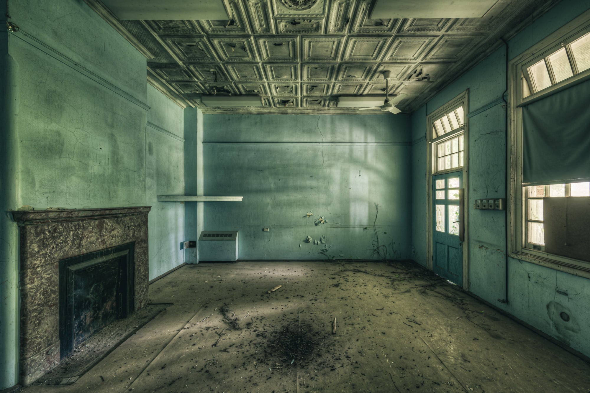 Beyond the Pale at The Asylum, a pressed metal ceiling spans the room in a grid of ornamental panels, their edges darkened.