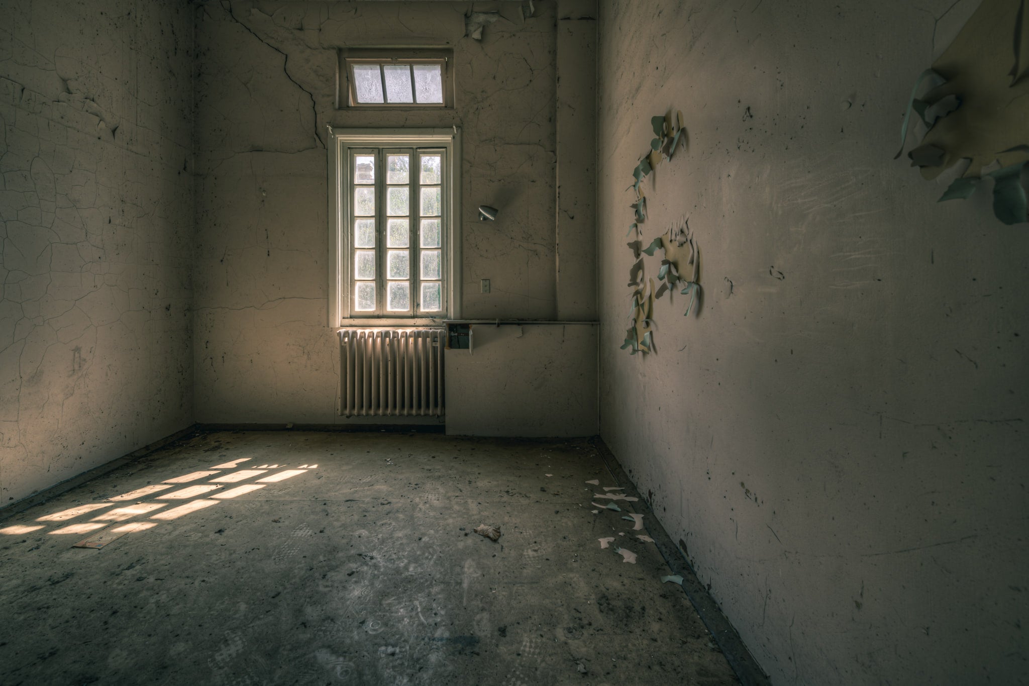Confinement at The Asylum, a bare room.