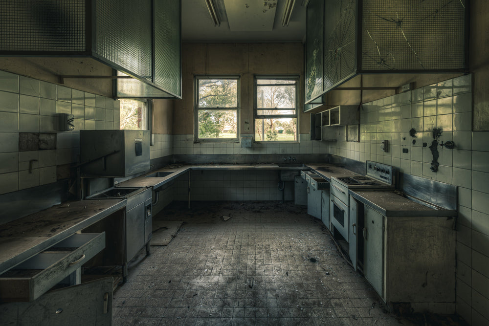 Dusty Kitchen at The Asylum, a commercial kitchen sits empty.