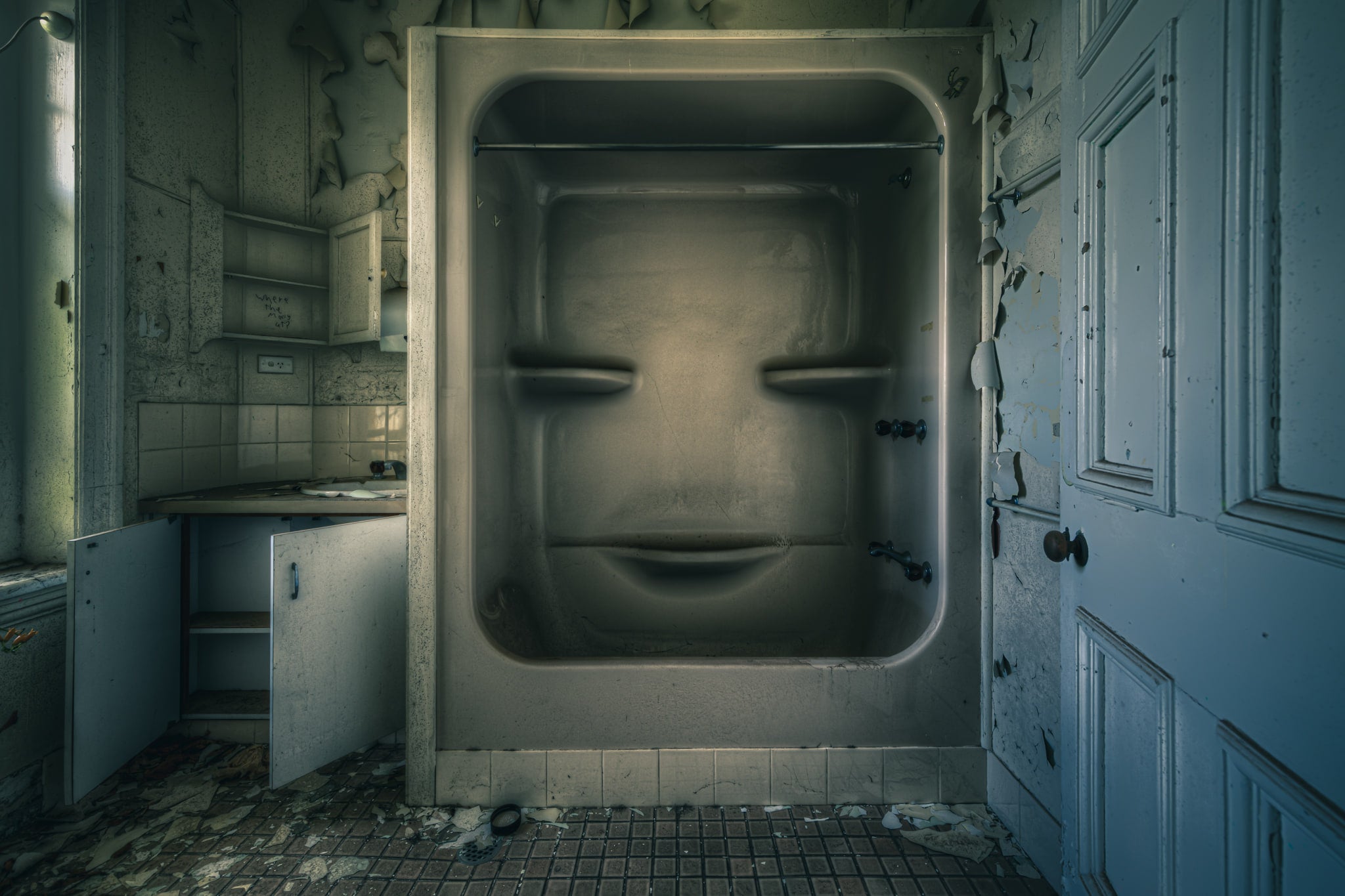 Face at The Asylum, a moulded fibreglass bath-shower unit sits recessed into the wall of a small washroom.