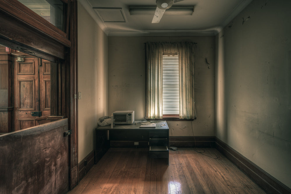 Office at The Asylum, a small office sits empty at the back of the building.