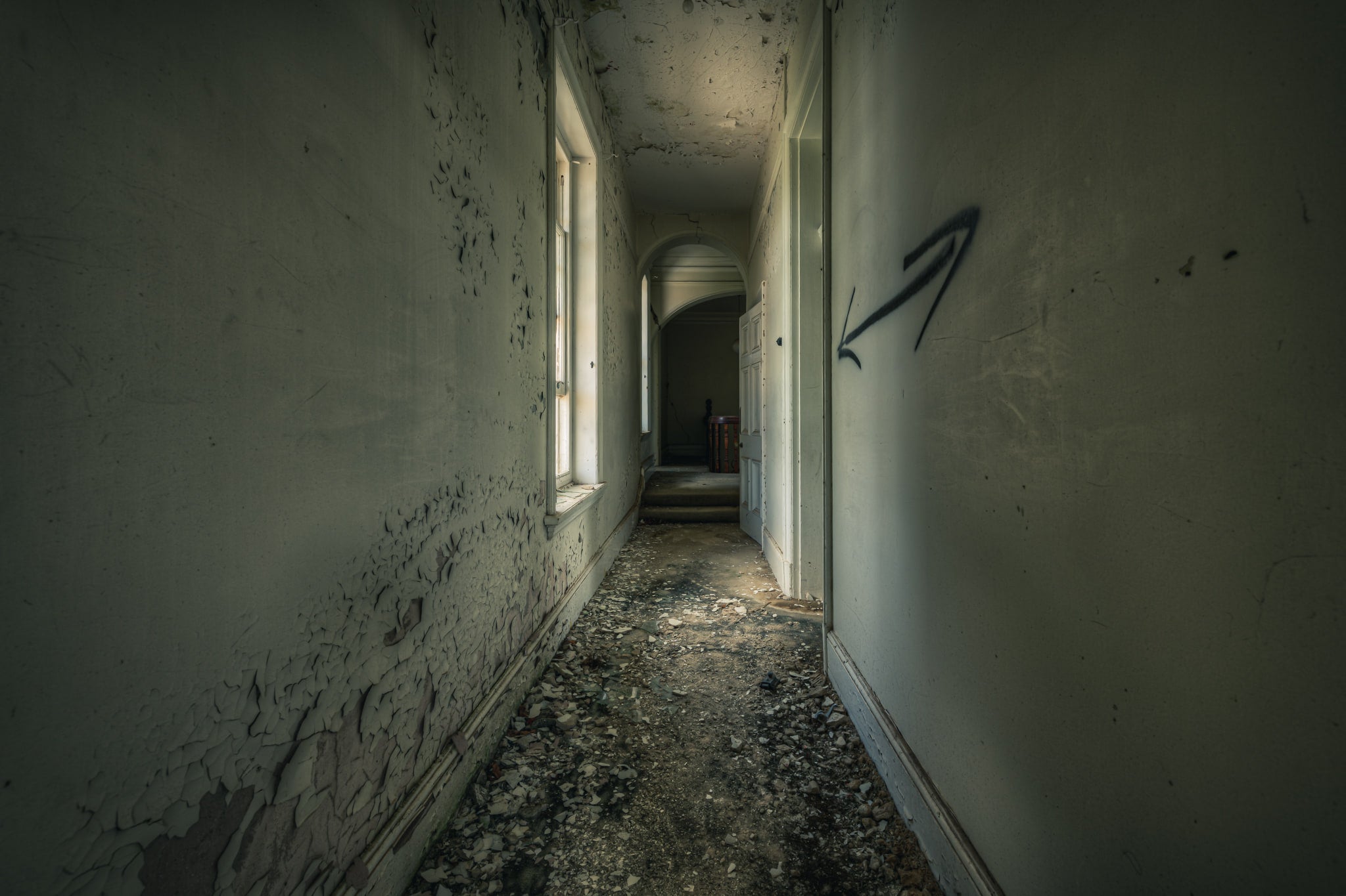 Walking on the Ceiling at The Asylum, a narrow corridor stretches deep into the building.
