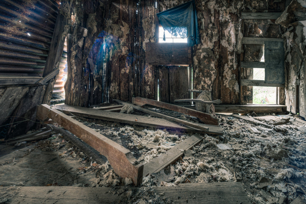 Main Bedroom Interior at The Post Office, collapsed timber framing covers the floor of what was the main bedroom.