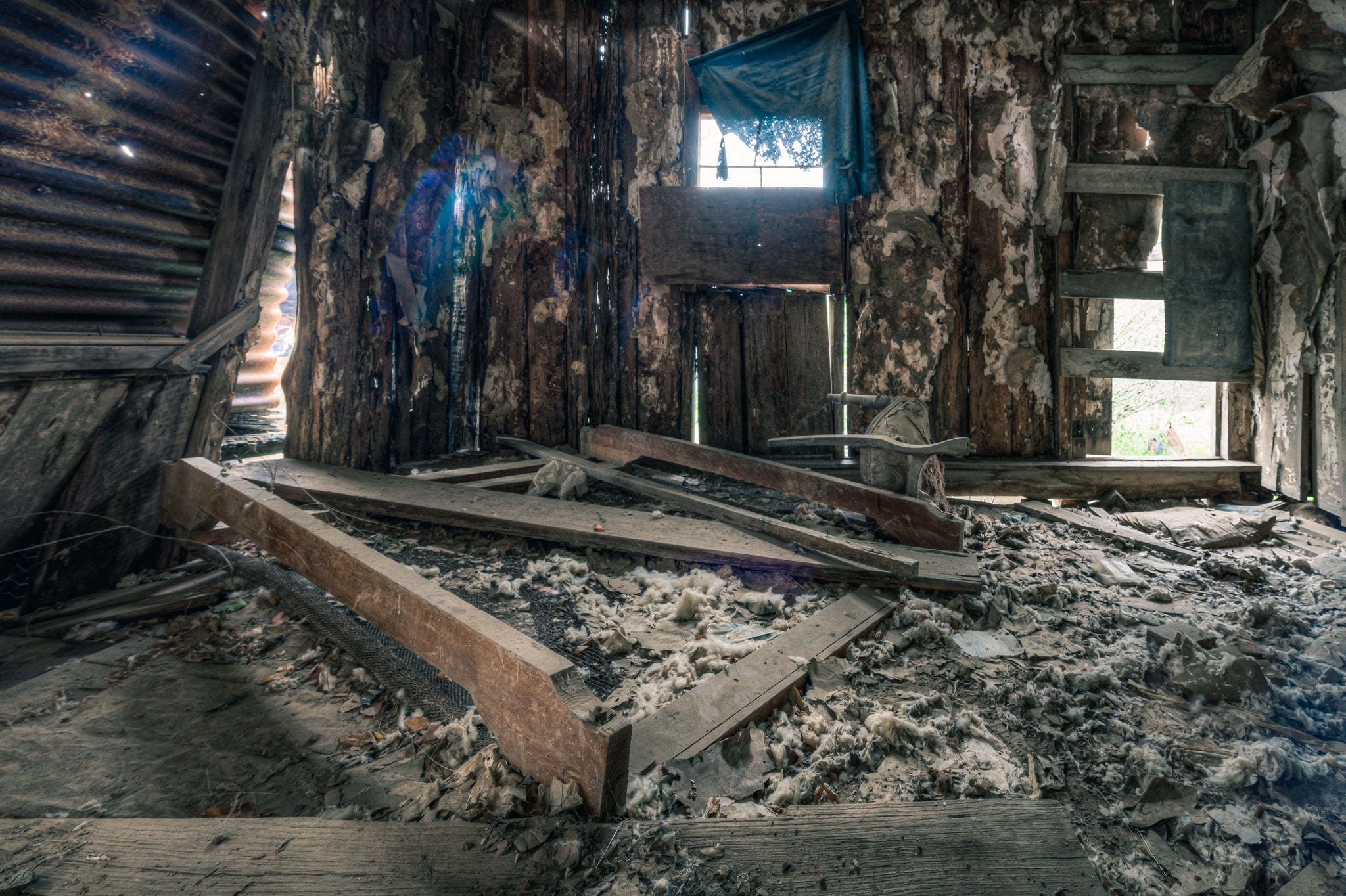 Main Bedroom Interior at The Post Office, collapsed timber framing covers the floor of what was the main bedroom.