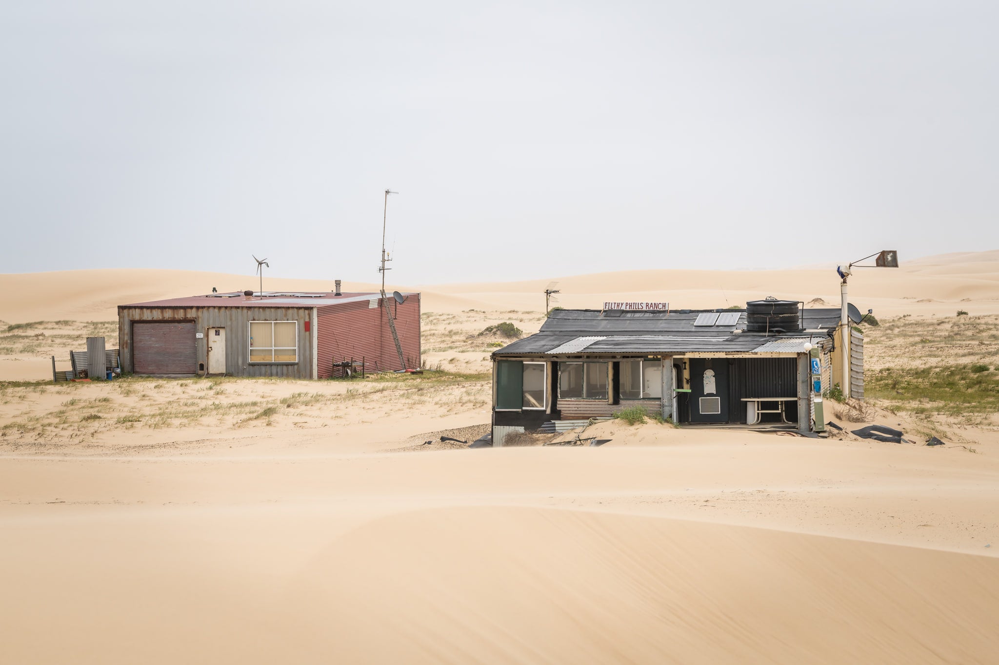 Filthy Phill And Seven at Tin City, two shacks sit low against the Stockton Bight dunes.