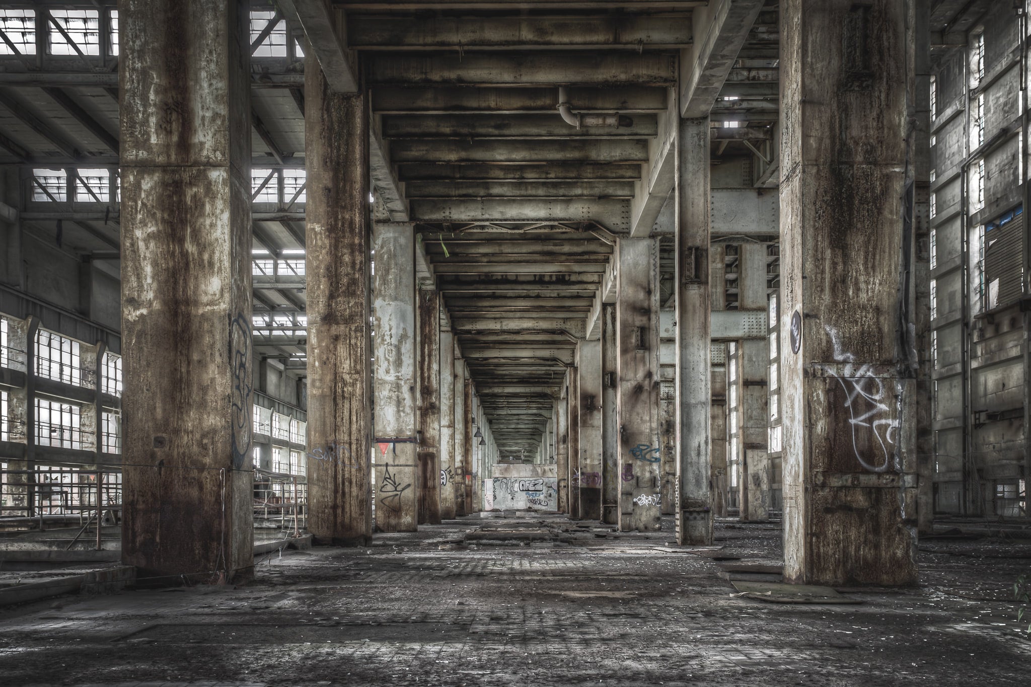 B Station Between Turbine Hall And Boiler House at Wangi Power Station, concrete columns run in two rows down a central.