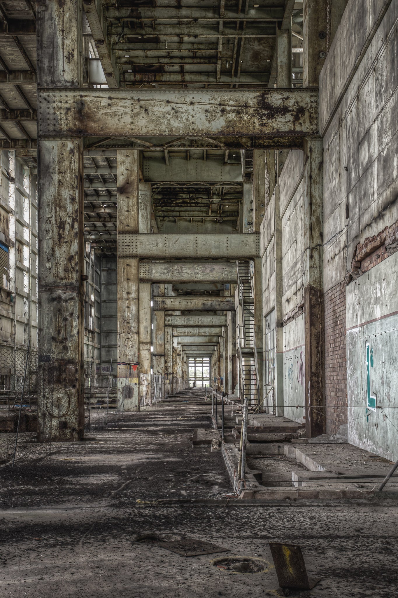 Boiler House Walkway at Wangi Power Station, a long corridor runs between massive concrete columns and the brick.