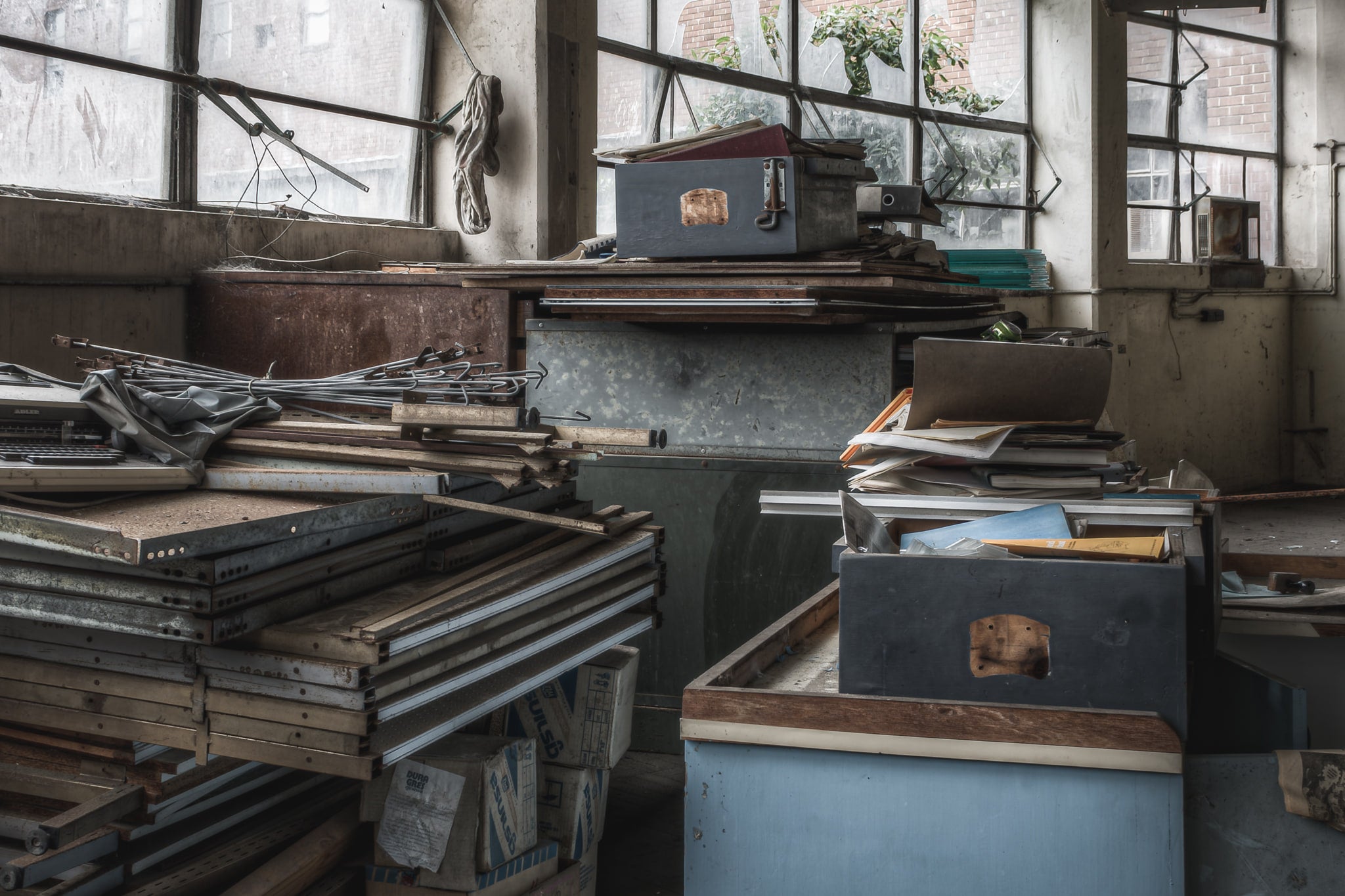 Collapsed Shelving at Wangi Power Station, stacks of dismantled shelving and filing drawers sit in storage within.