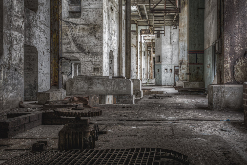 Condensation Extraction at Wangi Power Station, a heavy cast-iron gear assembly sits on the concrete floor, teeth thick.