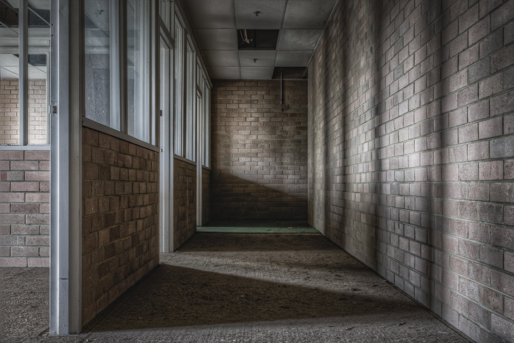 Engineers Office at Wangi Power Station, a narrow corridor of brown brick narrows toward a dead end.