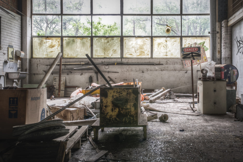 Plumbers Workshop at Wangi Power Station, a steel tool cabinet sits overturned on the concrete floor, its green paint.