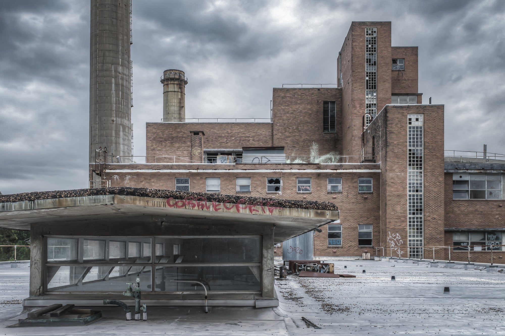 Store Roof at Wangi Power Station, perched above the boiler house, this commanding view captures the towering chimneys.