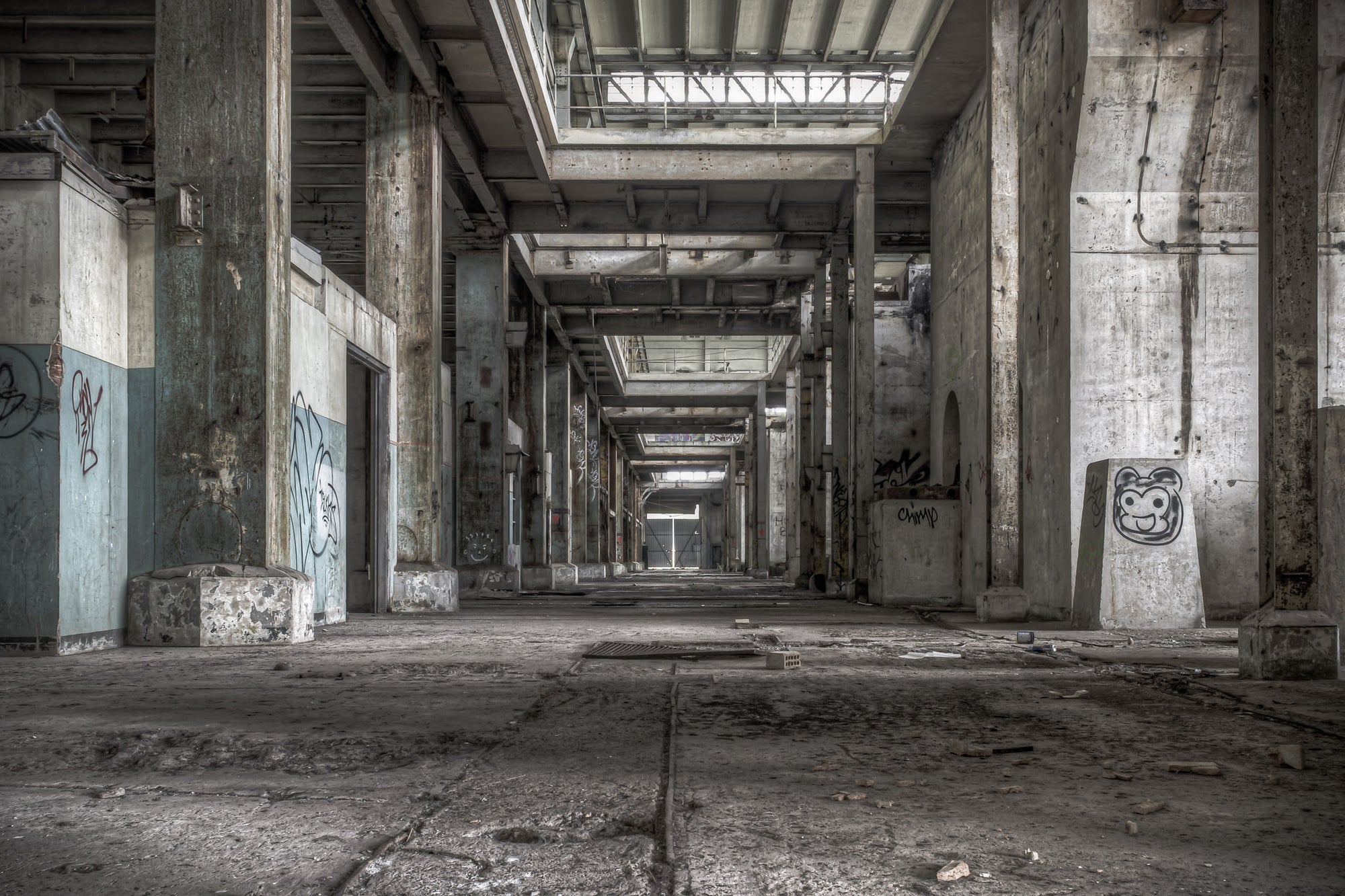 Turbine Hall Basement Looking Towards B Station at Wangi Power Station, reinforced concrete columns run in a long corridor.