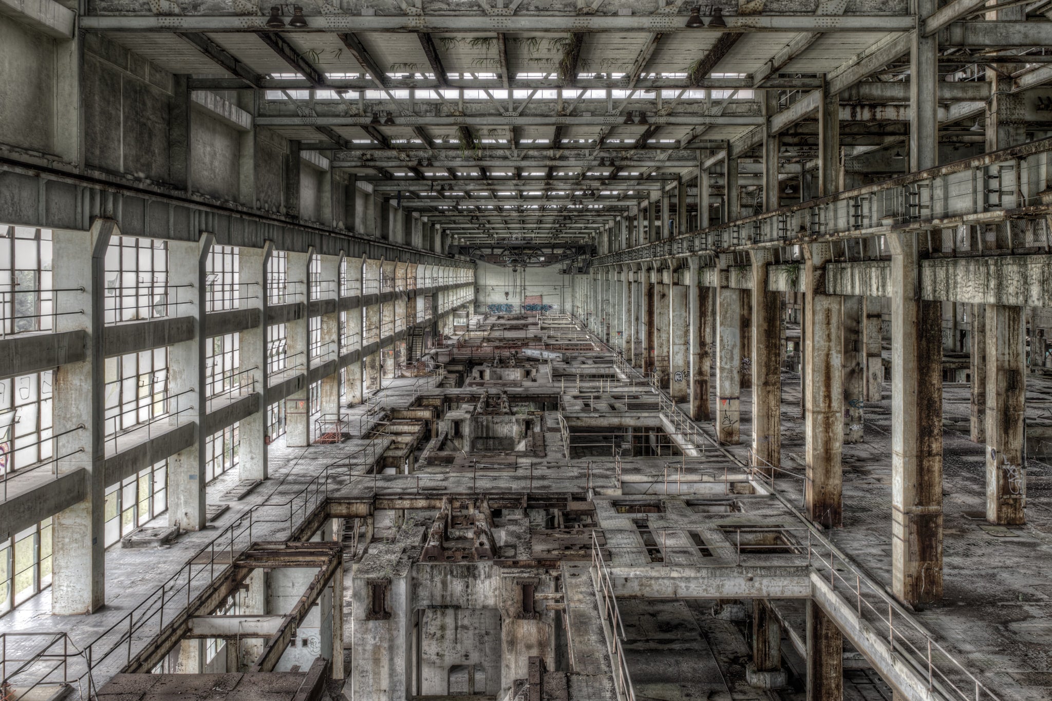Turbine Hall Walkway at Wangi Power Station, the turbine hall stretches deep into the building, concrete columns running.